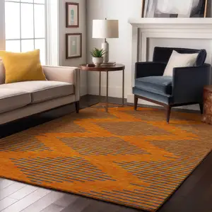 Photo of Orange And Navy Blue Geometric Washable Area Rug With UV Protection