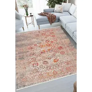 Photo of Orange And Red Floral Distressed Area Rug