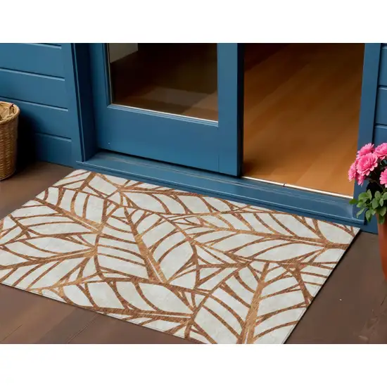 Orange Beige And Copper Floral Washable Indoor Outdoor Area Rug Photo 1