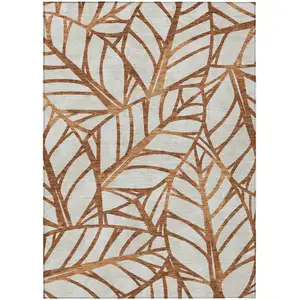 Photo of Orange Beige And Copper Floral Washable Indoor Outdoor Area Rug