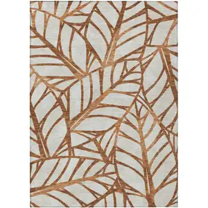 Photo of Orange Beige And Copper Floral Washable Indoor Outdoor Area Rug