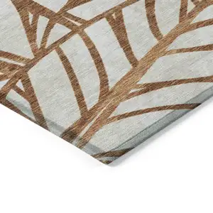 Photo of Orange Beige And Copper Floral Washable Indoor Outdoor Area Rug