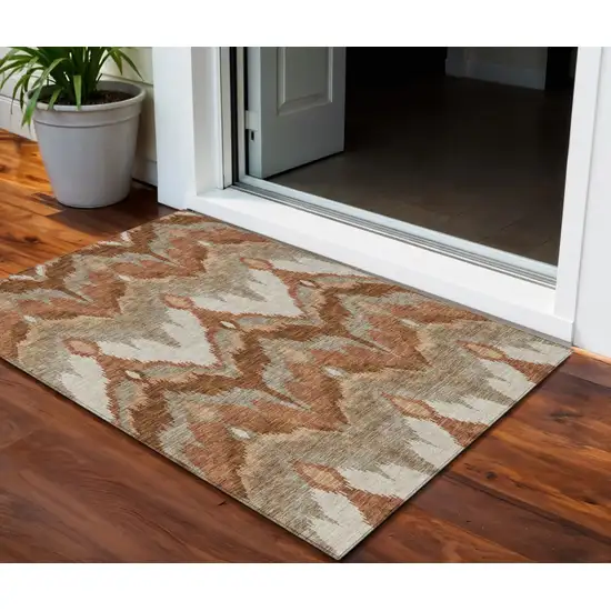 Orange Beige And Copper Ikat Washable Indoor Outdoor Area Rug Photo 1