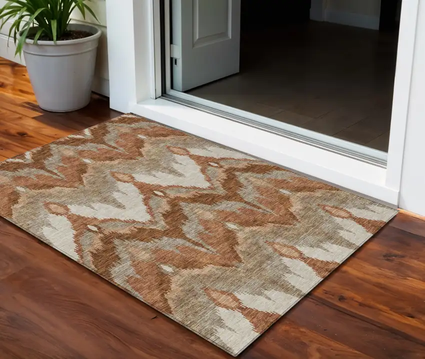 Orange Beige And Copper Ikat Washable Indoor Outdoor Area Rug Photo 1