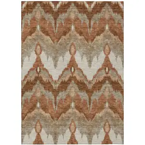 Photo of Orange Beige And Copper Ikat Washable Indoor Outdoor Area Rug