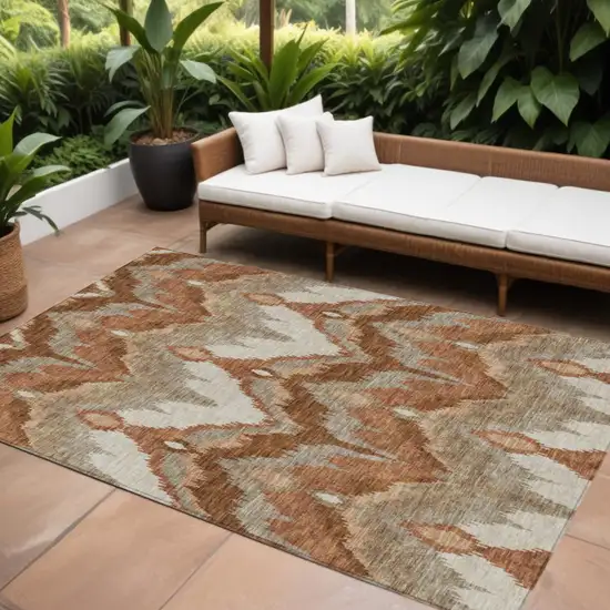 Orange Beige And Copper Ikat Washable Indoor Outdoor Area Rug Photo 1
