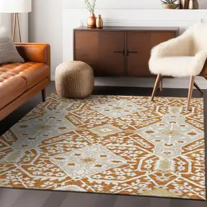 Photo of Orange Beige And Gold Floral Washable Indoor Outdoor Area Rug