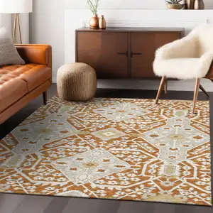 Photo of Orange Beige And Gold Floral Washable Indoor Outdoor Area Rug