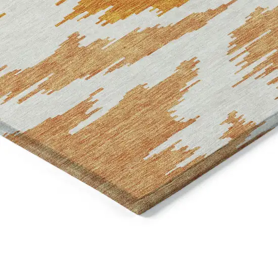 Orange Beige And Ivory Abstract Washable Indoor Outdoor Area Rug Photo 4