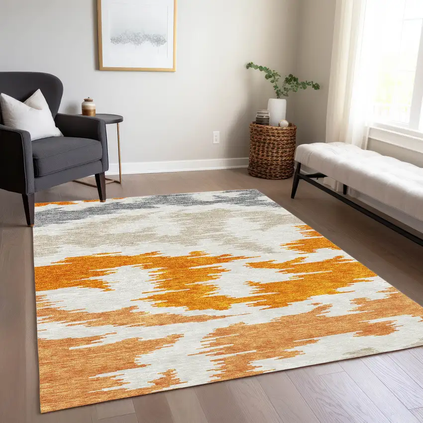Orange Beige And Ivory Abstract Washable Indoor Outdoor Area Rug Photo 9