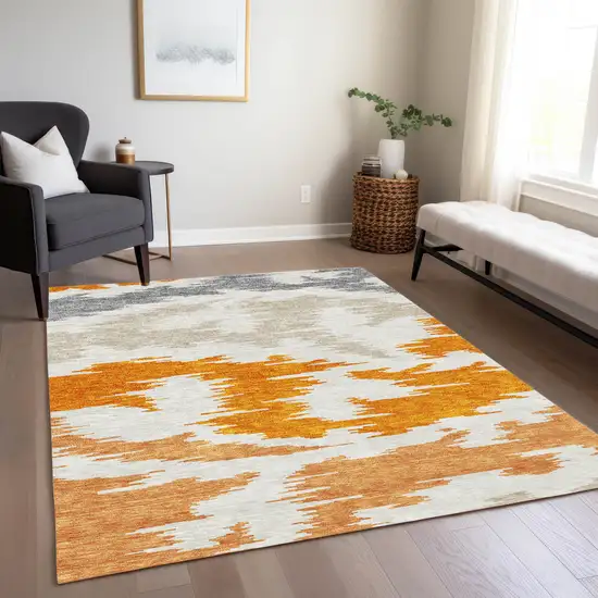 Orange Beige And Ivory Abstract Washable Indoor Outdoor Area Rug Photo 9