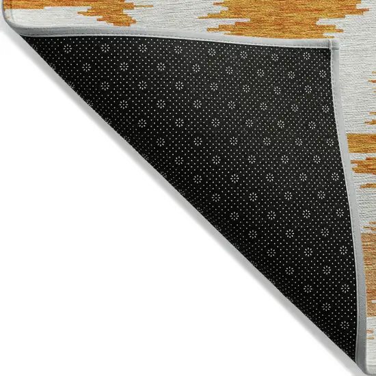 Orange Beige And Ivory Abstract Washable Indoor Outdoor Area Rug Photo 3