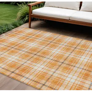 Photo of Orange Blue And Ivory Plaid Washable Indoor Outdoor Area Rug