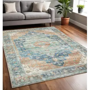 Photo of Orange Blue Teal Green And Beige Oriental Power Loom Stain Resistant Area Rug
