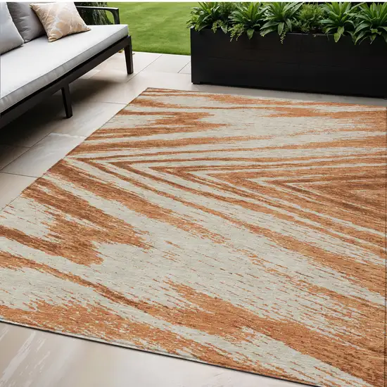 Orange Brown And Beige Abstract Washable Indoor Outdoor Area Rug Photo 1