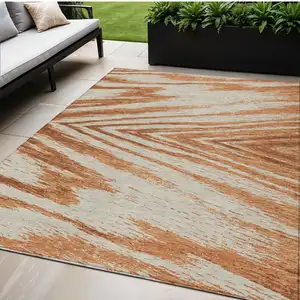 Photo of Orange Brown And Beige Abstract Washable Indoor Outdoor Area Rug