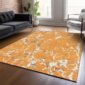 Photo of Orange Brown And Ivory Striped Washable Indoor Outdoor Area Rug