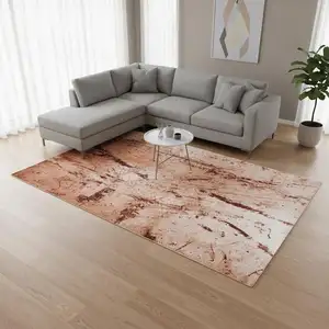 Photo of Orange Brown And White Abstract Washable Area Rug With UV Protection