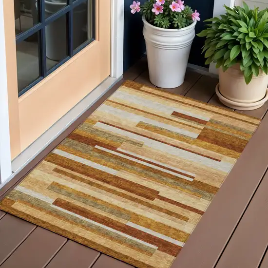 Orange Copper And Taupe Striped Washable Indoor Outdoor Area Rug Photo 1
