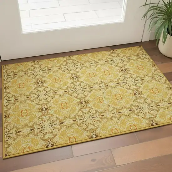 Orange Gold And Ivory Medallion Washable Area Rug With UV Protection Photo 2