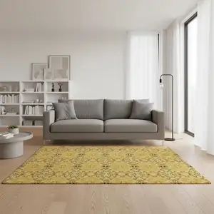 Photo of Orange Gold And Ivory Medallion Washable Area Rug With UV Protection