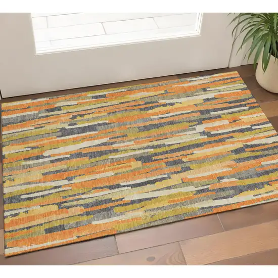 Orange Gold And Ivory Striped Washable Area Rug With UV Protection Photo 1
