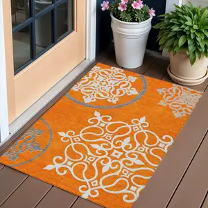 Photo of Orange Gray And Ivory Floral Medallion Washable Indoor Outdoor Area Rug