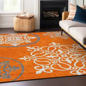 Photo of Orange Gray And Ivory Floral Medallion Washable Indoor Outdoor Area Rug