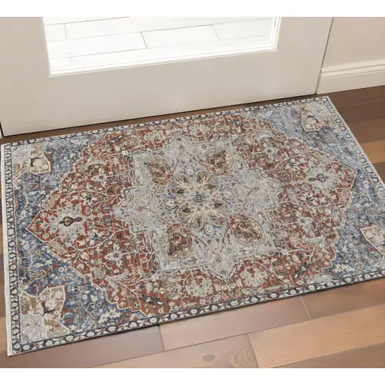 Burnt Orange Ivory And Blue Floral Area Rug With Fringe Photo 1