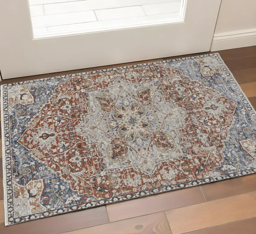 Burnt Orange Ivory And Blue Floral Area Rug With Fringe Photo 1