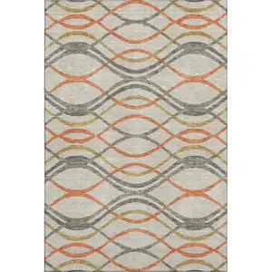 Photo of Orange Ivory And Gold Abstract Washable Area Rug With UV Protection