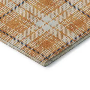 Photo of Orange Ivory And Navy Blue Plaid Washable Area Rug With UV Protection