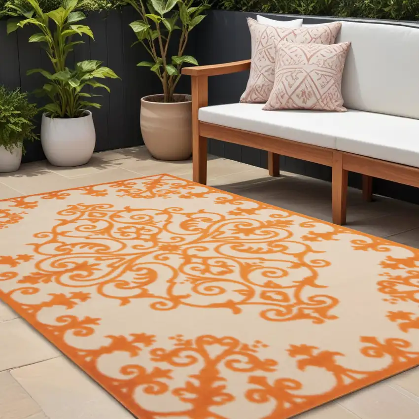 Orange And Ivory Damask Indoor Outdoor Area Rug Photo 1
