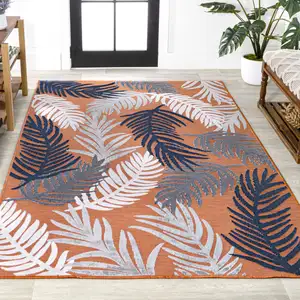 Photo of Orange Navy Blue And Ivory Floral Indoor Outdoor Area Rug
