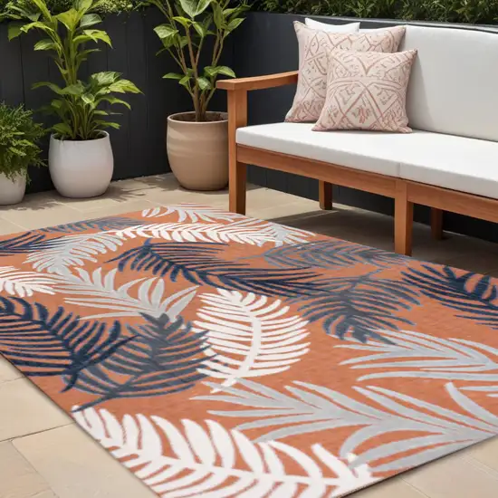 Orange Navy Blue And Ivory Floral Indoor Outdoor Area Rug Photo 1