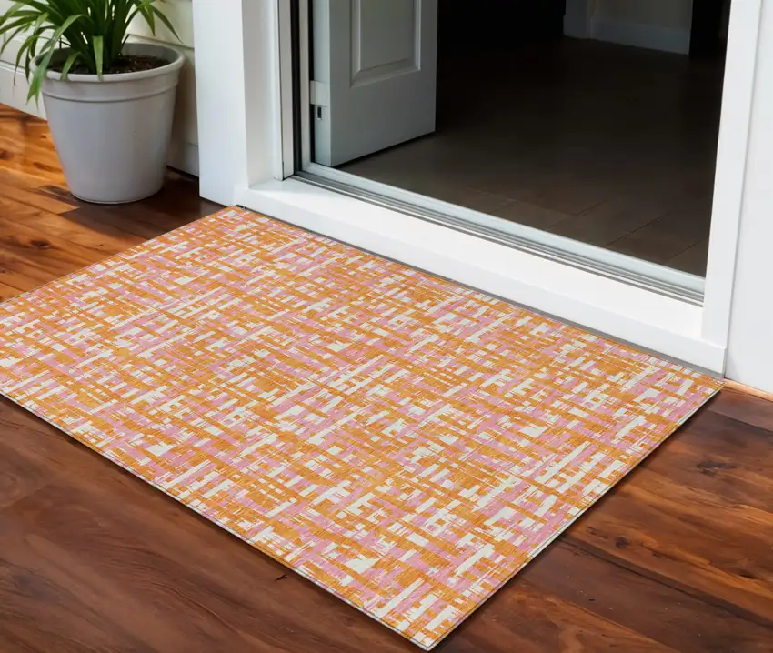 Orange Pink And Beige Abstract Washable Indoor Outdoor Area Rug Photo 1