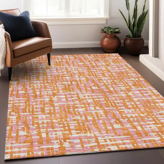 Orange Pink And Beige Abstract Washable Indoor Outdoor Area Rug Photo 9