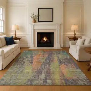 Photo of Orange Teal And Gold Abstract Washable Area Rug With UV Protection
