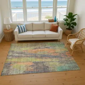 Photo of Orange Teal And Gold Abstract Washable Area Rug With UV Protection
