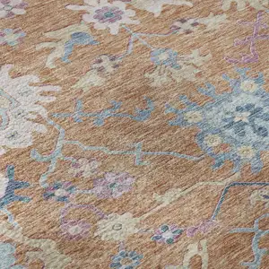 Photo of Orange Teal And Pink Floral Washable Area Rug With UV Protection