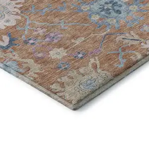 Photo of Orange Teal And Pink Floral Washable Area Rug With UV Protection