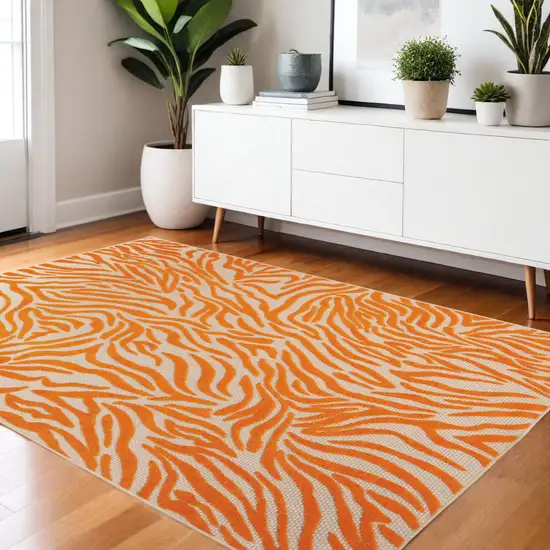 Orange And Ivory Abstract Stain Resistant Indoor Outdoor Area Rug Photo 2