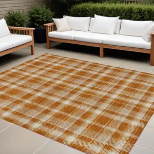 Photo of Orange and Ivory Plaid Washable Non Skid Indoor Outdoor Area Rug