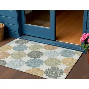 Photo of Pacific Blue Ivory And Copper Quatrefoil Washable Indoor Outdoor Area Rug