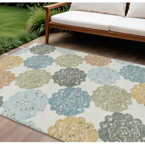 Photo of Pacific Blue Ivory And Copper Quatrefoil Washable Indoor Outdoor Area Rug