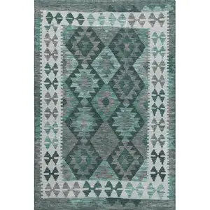 Photo of Pale Aqua And Ivory Tribal Washable Area Rug With UV Protection