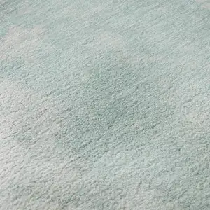 Photo of Pale Aqua Gray And Ivory Abstract Washable Area Rug With UV Protection