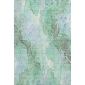 Photo of Pale Aqua Green And Ivory Abstract Washable Area Rug With UV Protection
