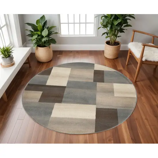 8' Gray Tan And Brown Patchwork Round Rug Photo 1