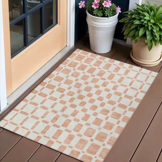 Peach And Beige Geometric Washable Indoor Outdoor Area Rug Photo 1